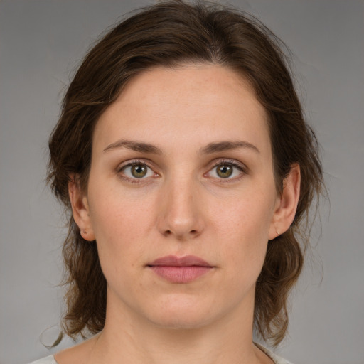 Neutral white young-adult female with medium  brown hair and brown eyes