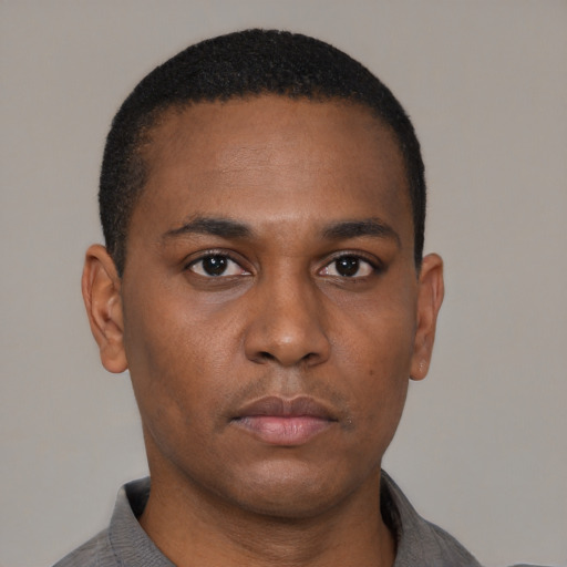 Neutral black young-adult male with short  black hair and brown eyes