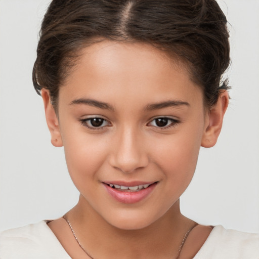 Joyful white child female with short  brown hair and brown eyes