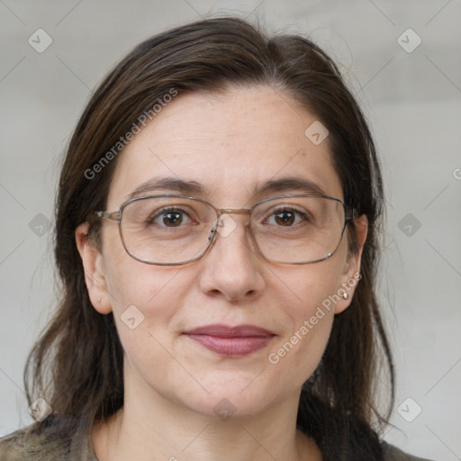 Joyful white adult female with medium  brown hair and brown eyes