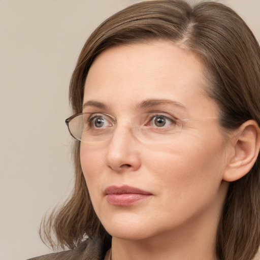 Neutral white adult female with medium  brown hair and grey eyes