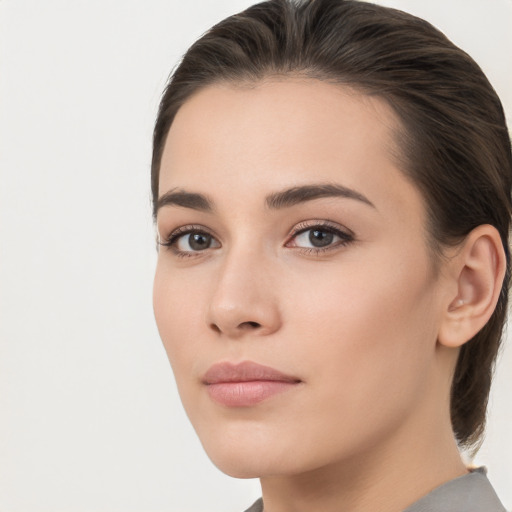 Neutral white young-adult female with medium  brown hair and brown eyes