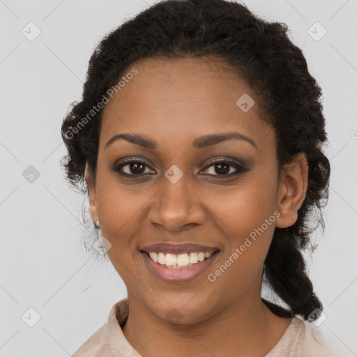 Joyful black young-adult female with long  brown hair and brown eyes