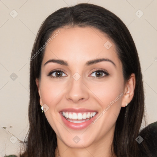 Joyful white young-adult female with long  black hair and brown eyes