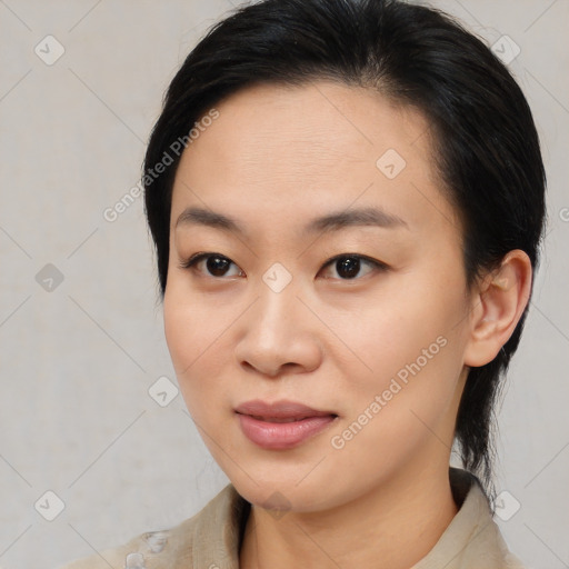 Joyful asian young-adult female with medium  black hair and brown eyes