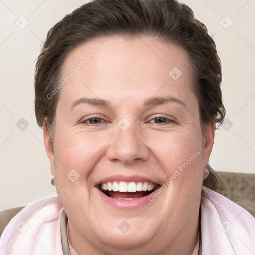 Joyful white adult female with short  brown hair and grey eyes