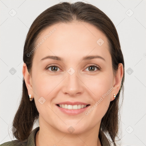 Joyful white young-adult female with long  brown hair and brown eyes