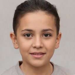 Joyful white child female with short  brown hair and brown eyes