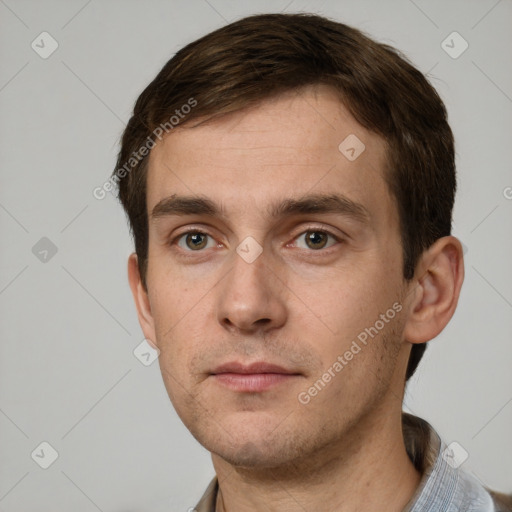 Neutral white young-adult male with short  brown hair and grey eyes