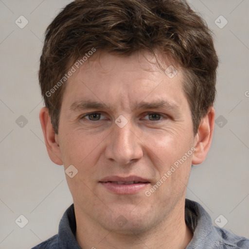 Joyful white adult male with short  brown hair and grey eyes