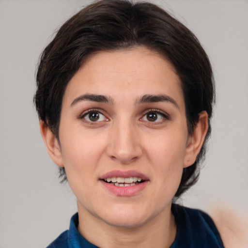 Joyful white young-adult female with medium  brown hair and brown eyes