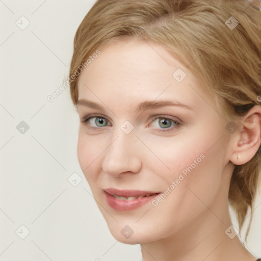 Joyful white young-adult female with medium  brown hair and blue eyes