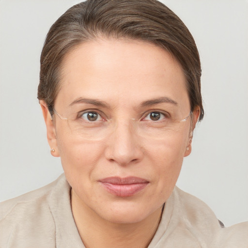 Joyful white adult female with short  brown hair and brown eyes