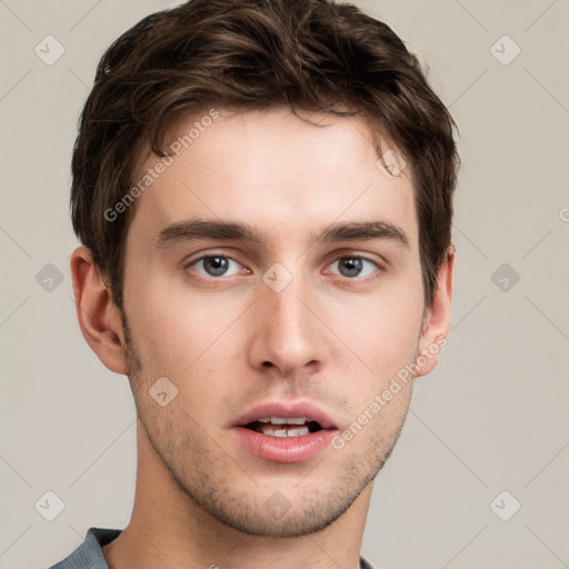 Neutral white young-adult male with short  brown hair and grey eyes