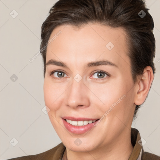 Joyful white young-adult female with short  brown hair and brown eyes