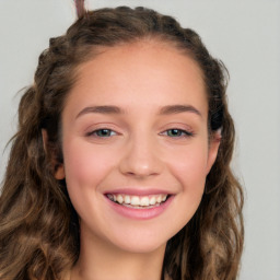 Joyful white young-adult female with long  brown hair and green eyes