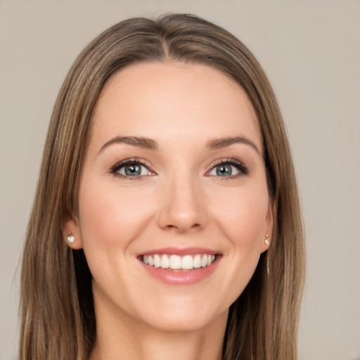 Joyful white young-adult female with long  brown hair and grey eyes