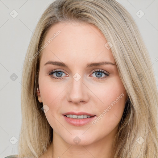 Joyful white young-adult female with long  brown hair and blue eyes