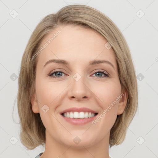 Joyful white young-adult female with medium  brown hair and blue eyes