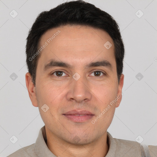 Joyful white adult male with short  black hair and brown eyes