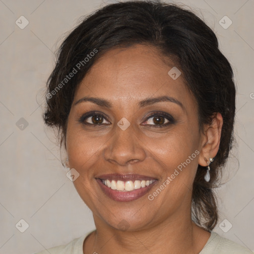 Joyful black adult female with medium  brown hair and brown eyes