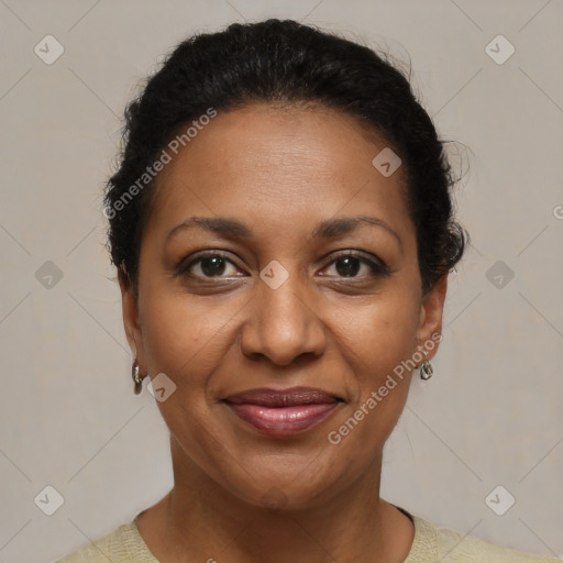 Joyful black adult female with short  brown hair and brown eyes