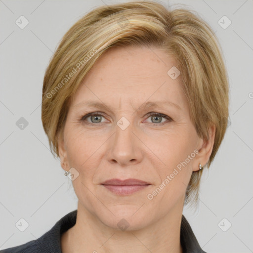 Joyful white adult female with medium  brown hair and grey eyes