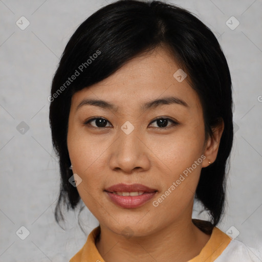 Joyful asian young-adult female with medium  black hair and brown eyes