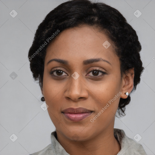 Joyful black adult female with short  black hair and brown eyes