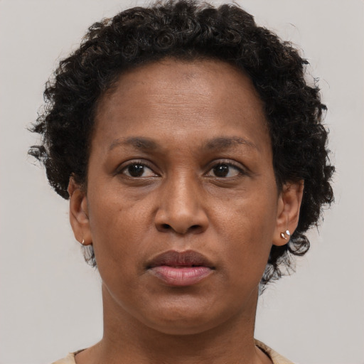 Neutral black adult female with short  brown hair and brown eyes