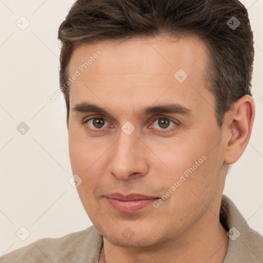 Joyful white young-adult male with short  brown hair and brown eyes