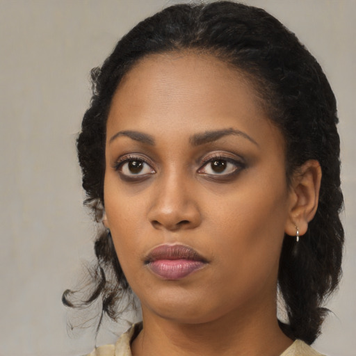 Neutral black young-adult female with medium  black hair and brown eyes