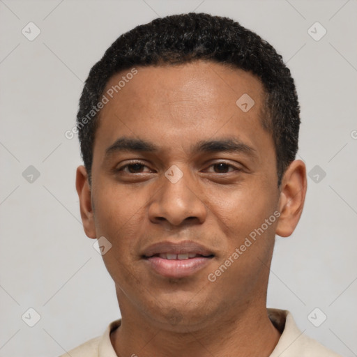 Joyful black young-adult male with short  black hair and brown eyes