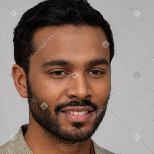 Joyful black young-adult male with short  black hair and brown eyes