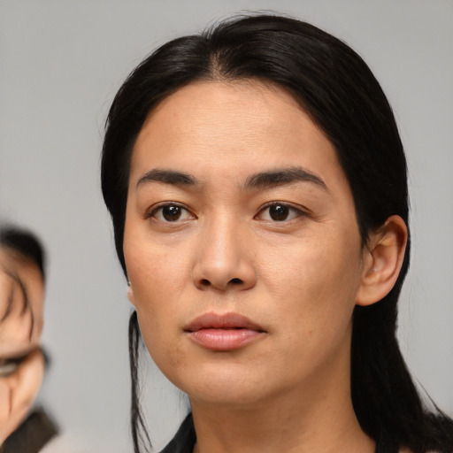 Neutral white young-adult female with medium  black hair and brown eyes
