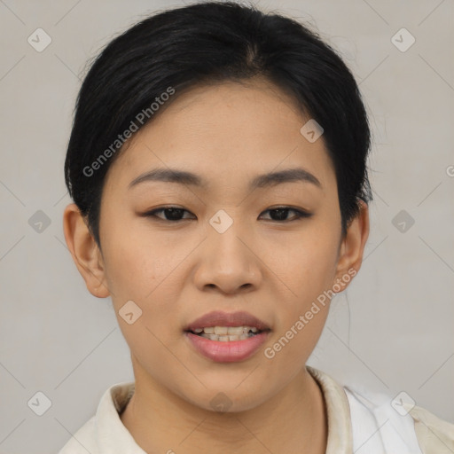 Joyful asian young-adult female with short  black hair and brown eyes