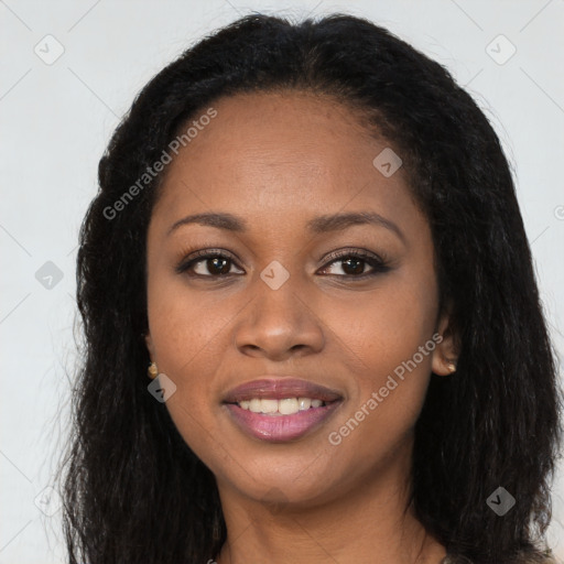 Joyful black young-adult female with long  brown hair and brown eyes