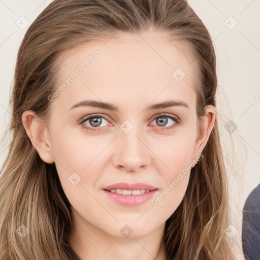 Joyful white young-adult female with long  brown hair and blue eyes