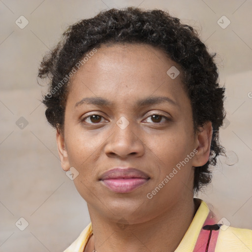 Joyful black young-adult female with short  brown hair and brown eyes