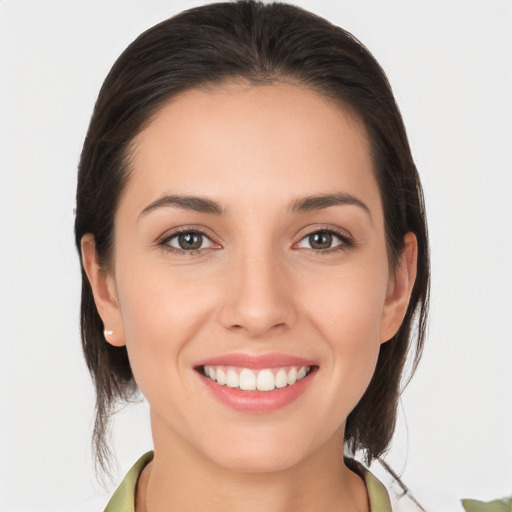 Joyful white young-adult female with medium  brown hair and brown eyes