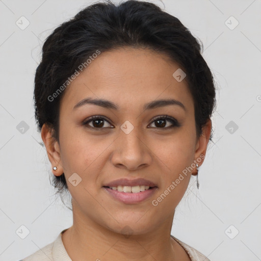 Joyful latino young-adult female with short  brown hair and brown eyes