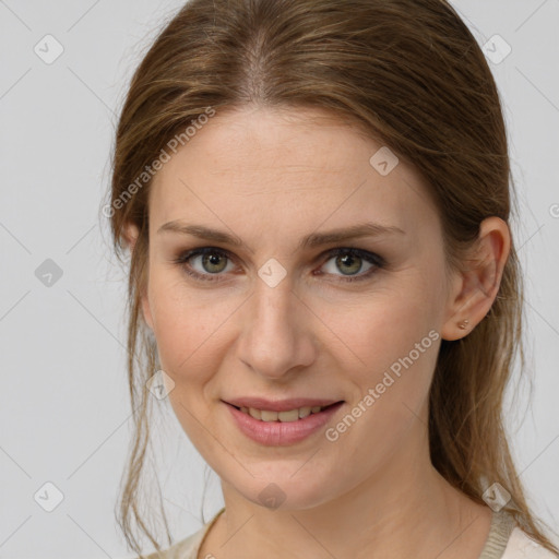 Joyful white young-adult female with medium  brown hair and grey eyes