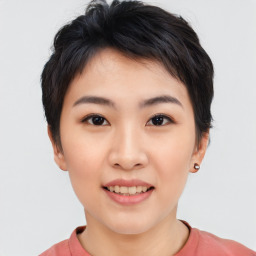 Joyful asian young-adult female with short  black hair and brown eyes