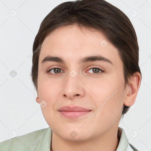 Joyful white young-adult female with short  brown hair and brown eyes