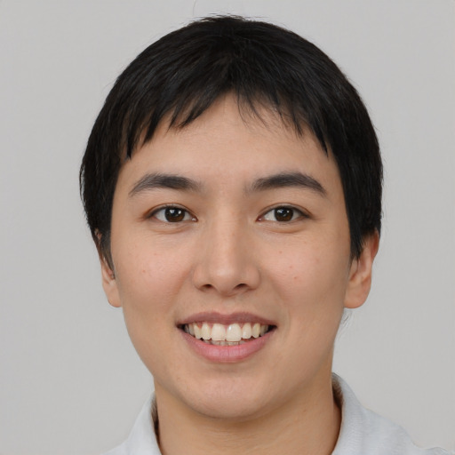 Joyful asian young-adult male with short  black hair and brown eyes