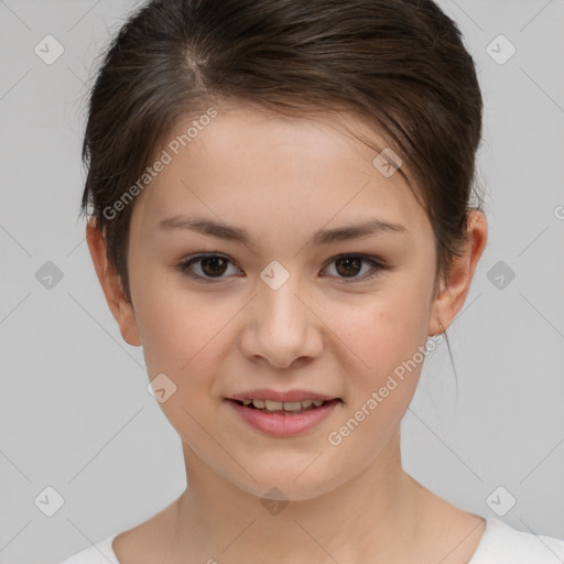 Joyful white child female with short  brown hair and brown eyes