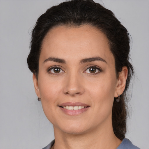 Joyful white young-adult female with medium  brown hair and brown eyes