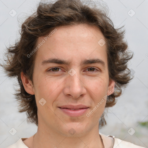 Joyful white adult male with medium  brown hair and brown eyes