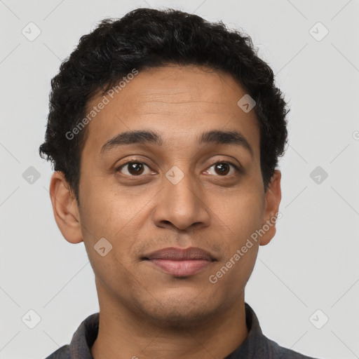 Joyful latino young-adult male with short  brown hair and brown eyes