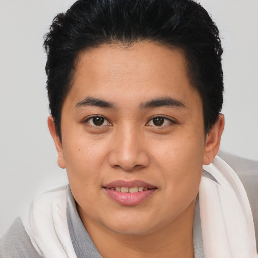 Joyful asian young-adult female with short  brown hair and brown eyes